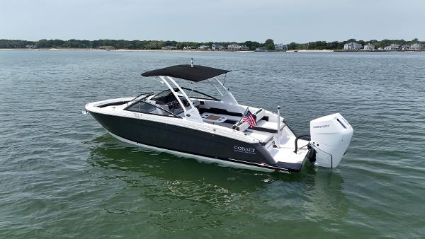 Cobalt R8 Outboard 2024 Cobalt R8 Outboard boat on calm water, featuring sleek design and modern outboard engine.