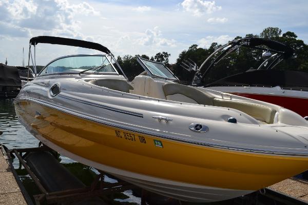 Sea Ray 240 Sundeck 2005 Sea Ray 240 Sundeck boat with yellow hull docked at marina.