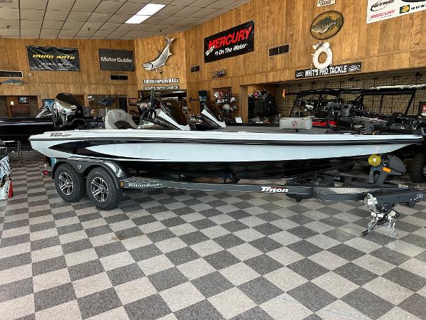 Triton 20XP Patriot 2024 Triton 20XP Patriot boat on display in a showroom.
