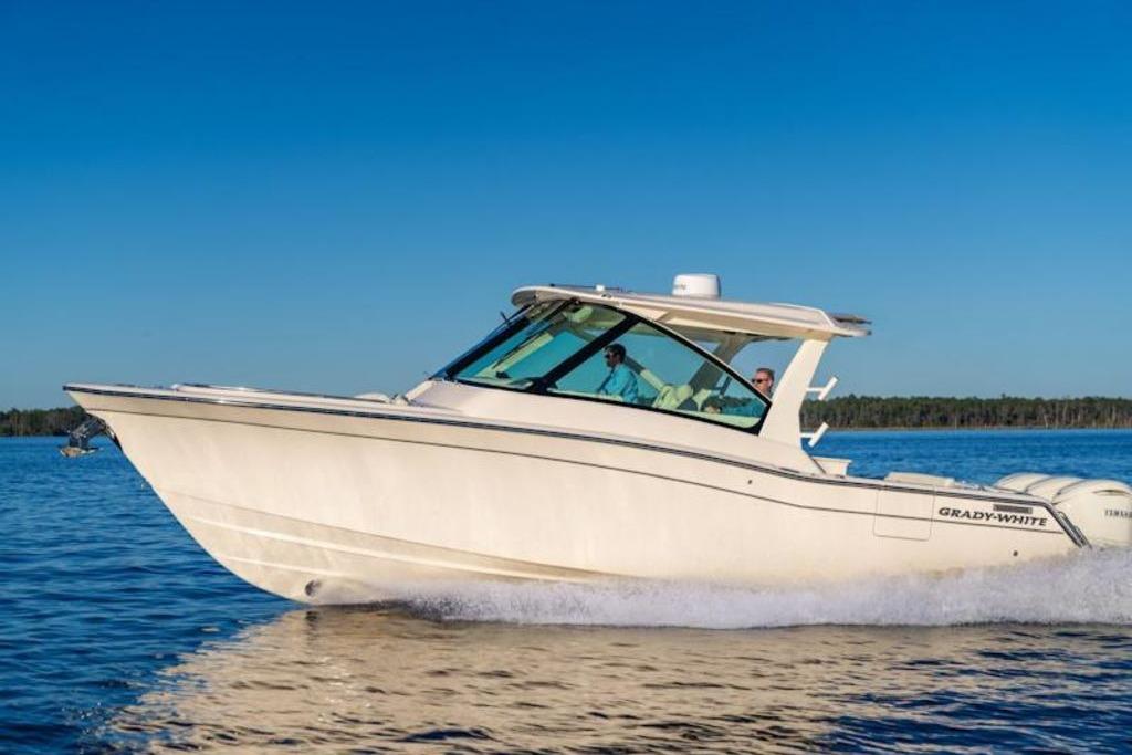 Grady-White Freedom 345 2026 Grady-White Freedom 345 boat cruising on a clear blue lake.