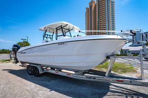 Twin Vee 280 GFX CC 2022 Twin Vee 280 GFX CC boat on trailer, urban background, clear sky.