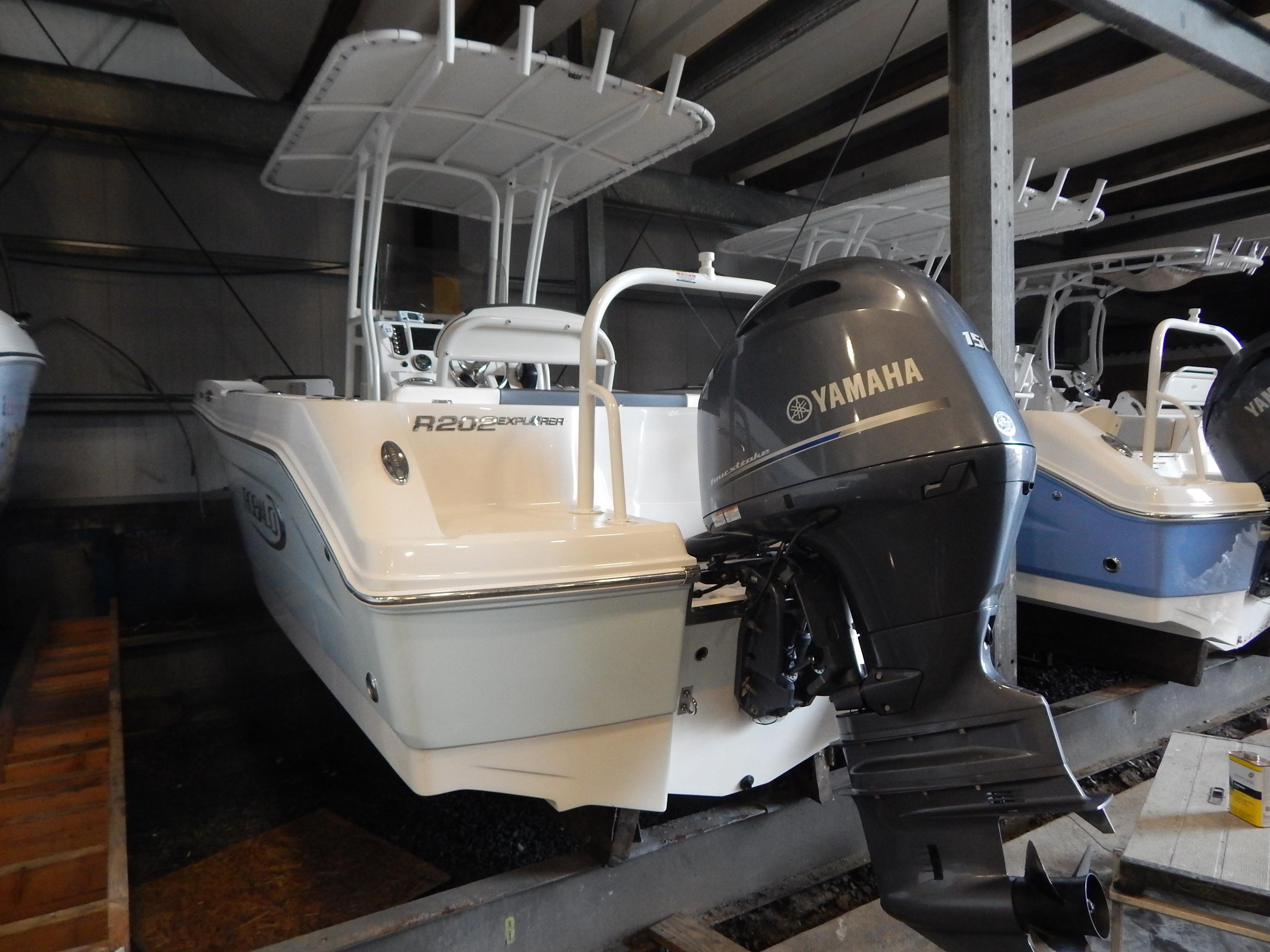 Robalo R202 Explorer 2019 Robalo R202 Explorer boat with Yamaha engine in storage facility.