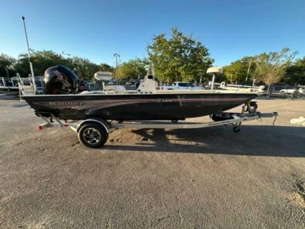 Ranger RB190 2024 Ranger RB190 boat on a trailer in a parking lot.