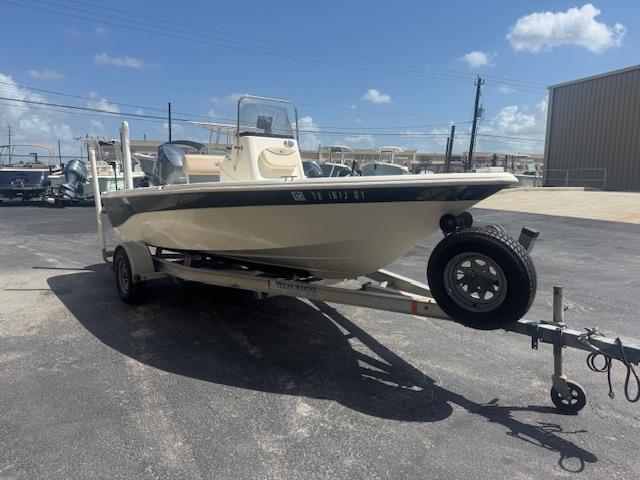 NauticStar 1810 NauticBay 2017 NauticStar 1810 NauticBay boat on trailer under clear blue sky.