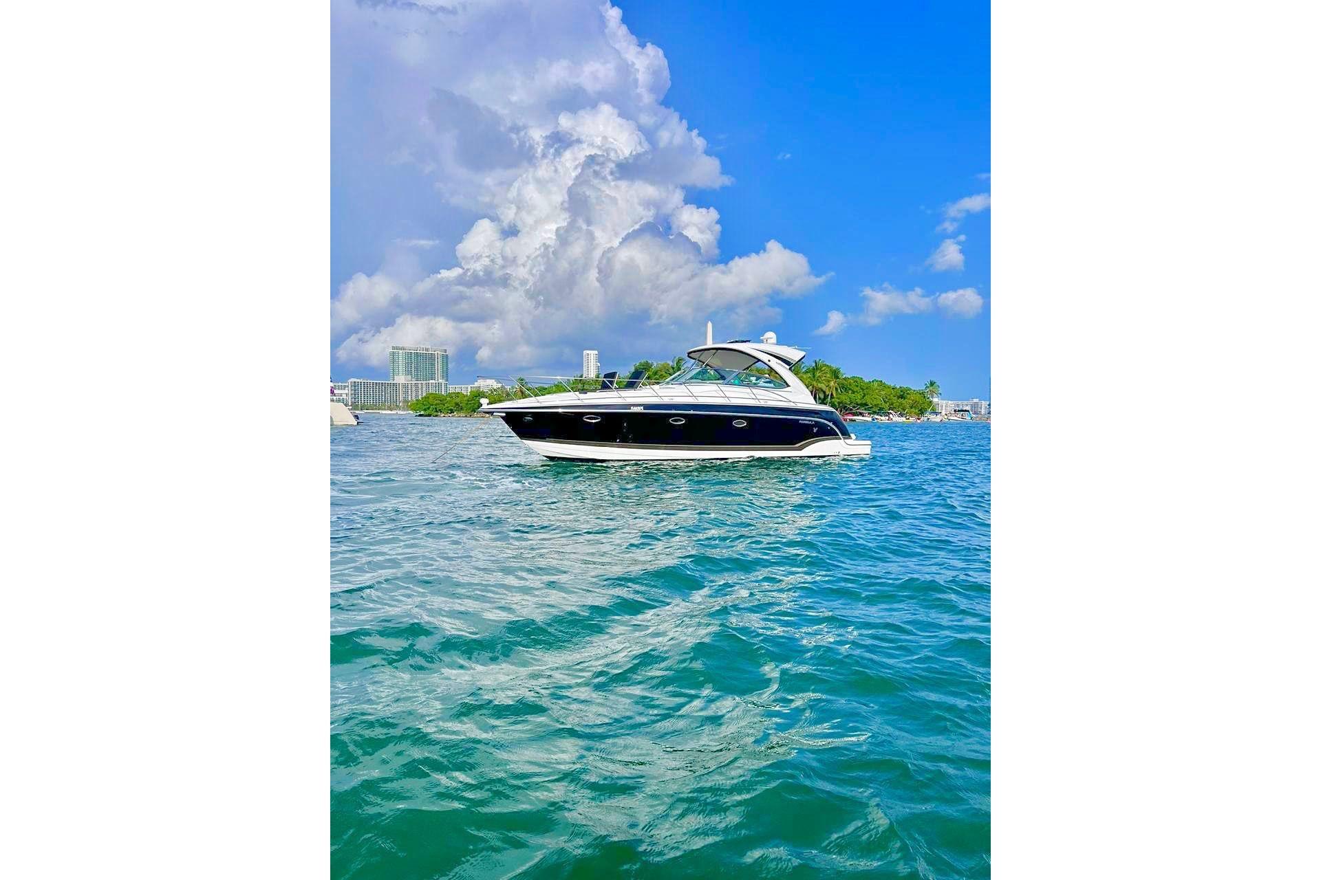 Formula 37 Performance Cruiser 2011 Formula 37 PC yacht cruising on clear blue waters under a vibrant sky.