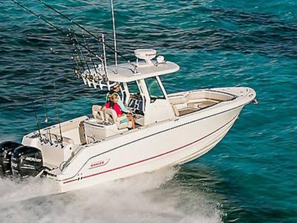 Boston Whaler 280 Outrage 2025 Boston Whaler 280 Outrage cruising on clear blue ocean waters.