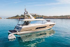 Prestige 680 Luxury 2016 Prestige 680 yacht anchored in clear blue waters.
