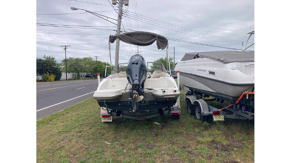Stingray 190 DC 2019 Stingray 190 DC boat parked on grass beside a road.
