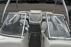 Bayliner 185 Runabout 2010 Bayliner 185 Runabout boat interior with open windshield and seating.
