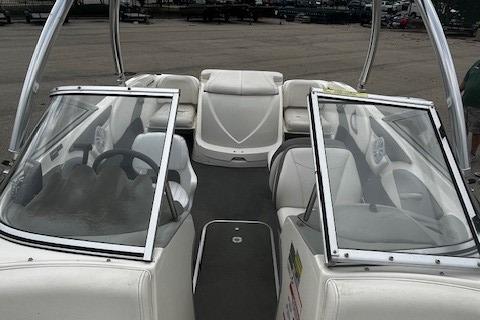 Bayliner 185 Runabout 2010 Bayliner 185 Runabout boat interior with open windshield and seating.