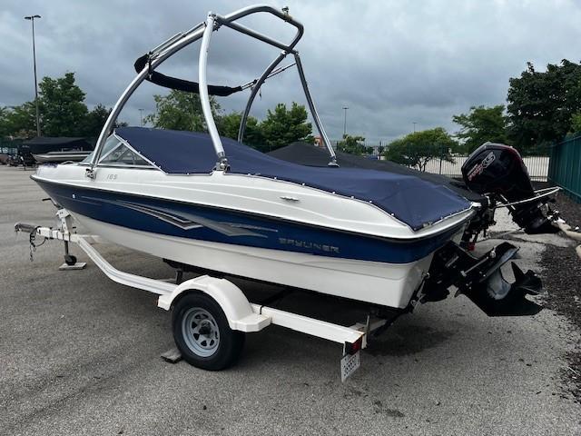 Bayliner 185S BOW RIDER 2010 Bayliner 185S Bow Rider on trailer, covered, parked outdoors.
