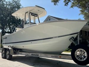 Regulator 23 Cc 2022 Regulator 23 CC boat on trailer, parked outdoors under clear sky.