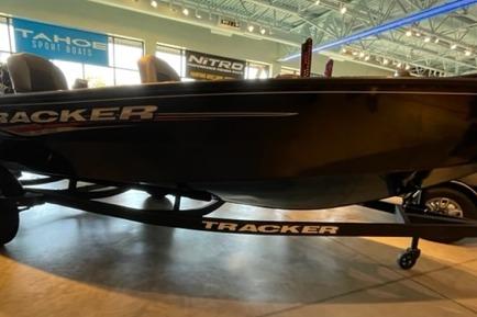 Tracker Super Guide V-16 T 2025 Tracker Super Guide V-16 T boat displayed indoors on a trailer.