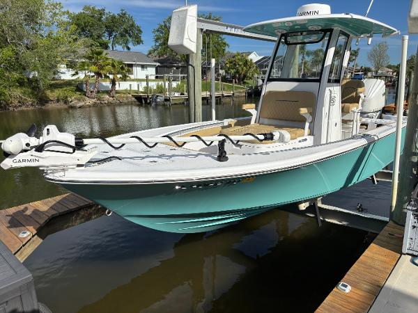 Sportsman Masters 247OE Bay Boat 2024 Sportsman Masters 247OE Bay Boat docked, featuring sleek design and Garmin equipment.