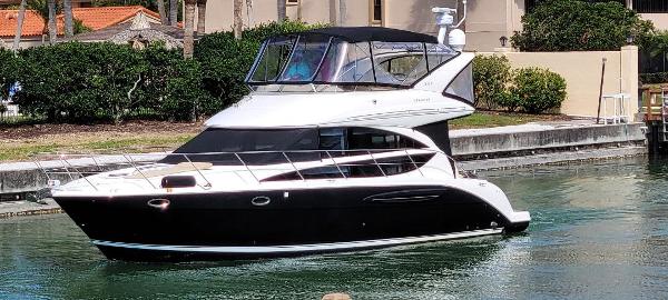 Meridian 391 Sedan 2016 Meridian 391 Sedan yacht cruising in a calm waterway.