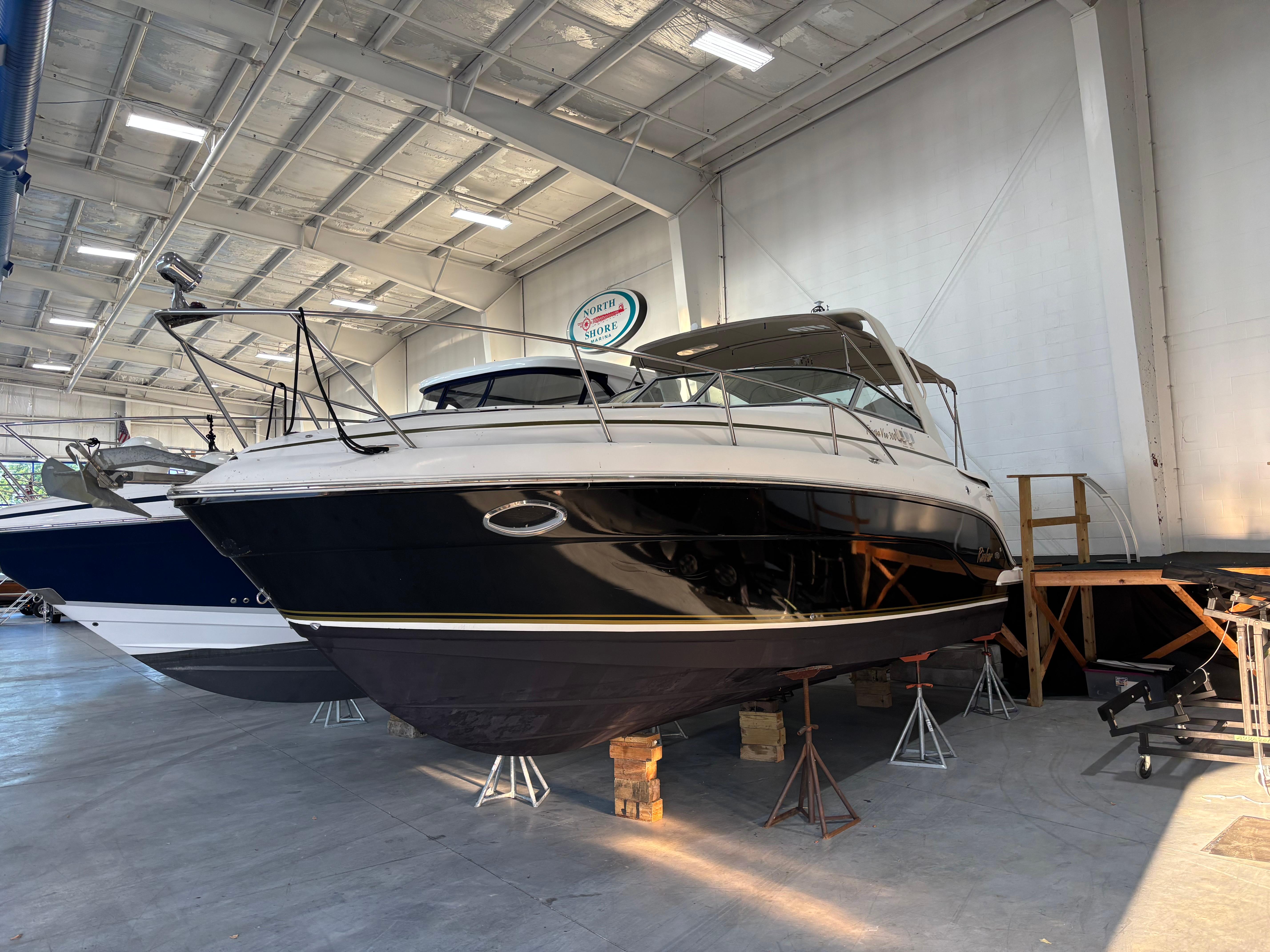 Rinker Fiesta Vee 300 2005 Rinker Fiesta Vee 300 boat in indoor storage facility.