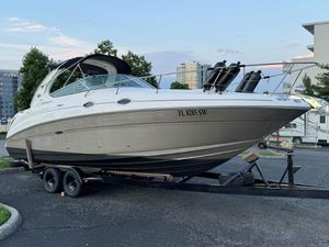 Sea Ray 280 Sundancer 2006 Sea Ray 280 Sundancer boat on trailer in urban setting.