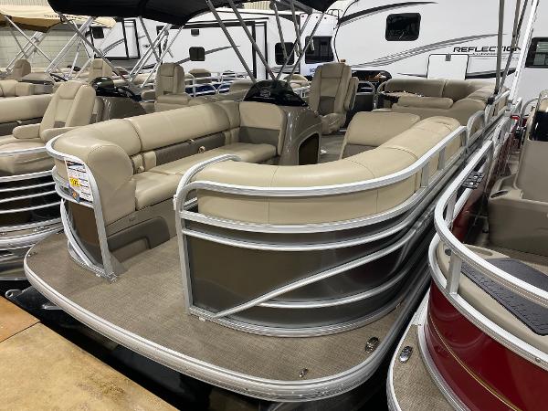 Sun Tracker Party Barge 20 DLX 2023 Sun Tracker Party Barge 20 DLX pontoon boat with beige seating and spacious deck.