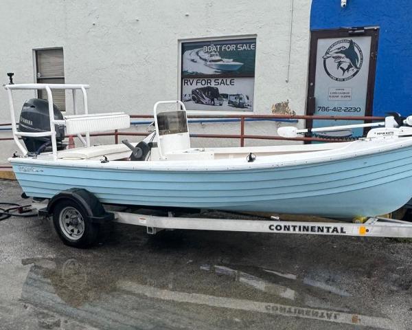Salt Creek 1500 2022 Salt Creek 1500 boat on trailer, displayed outside a sales shop.