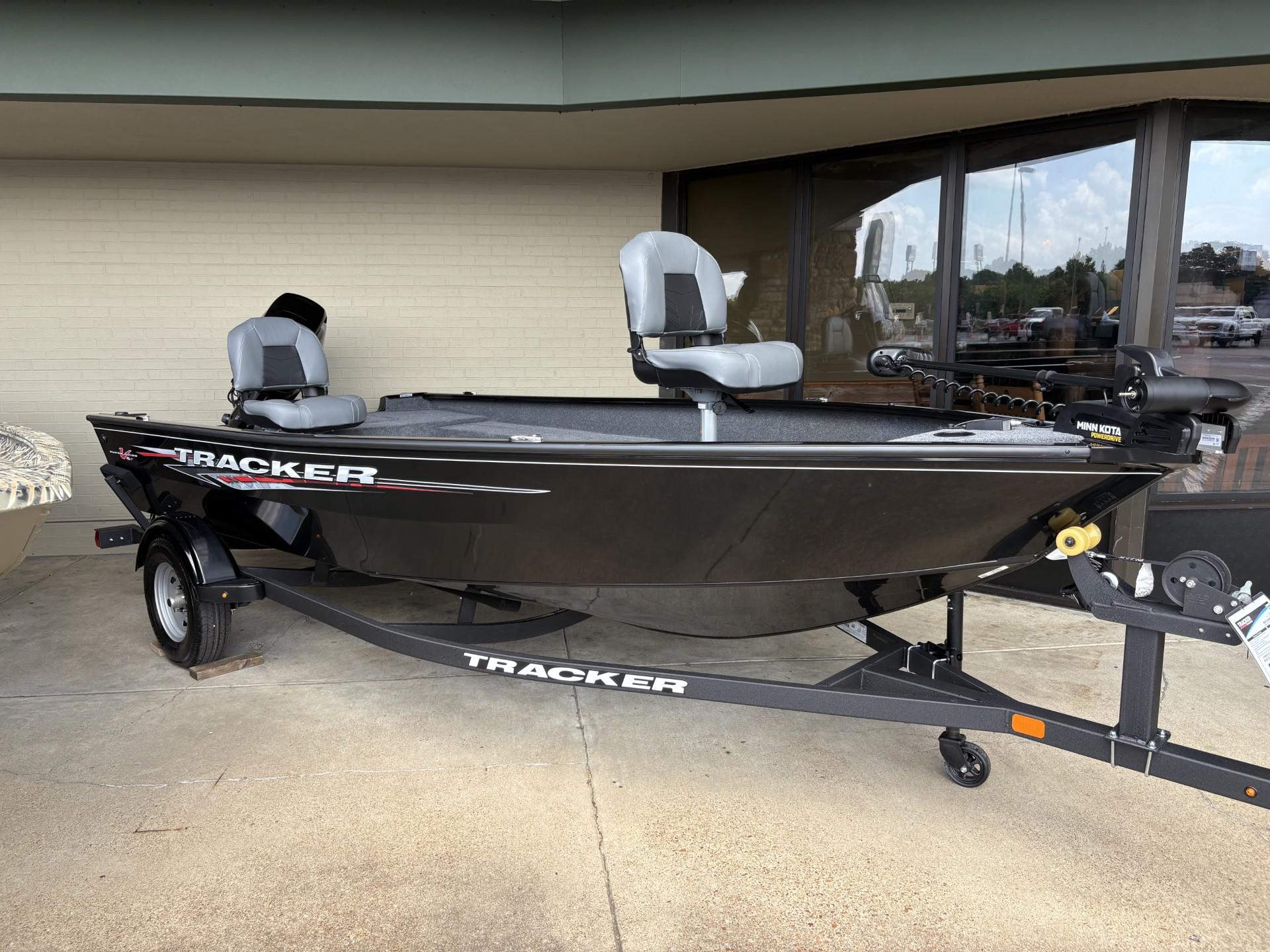 Tracker Super Guide V-16 T 2025 Tracker Super Guide V-16 T fishing boat on trailer, displayed outdoors.