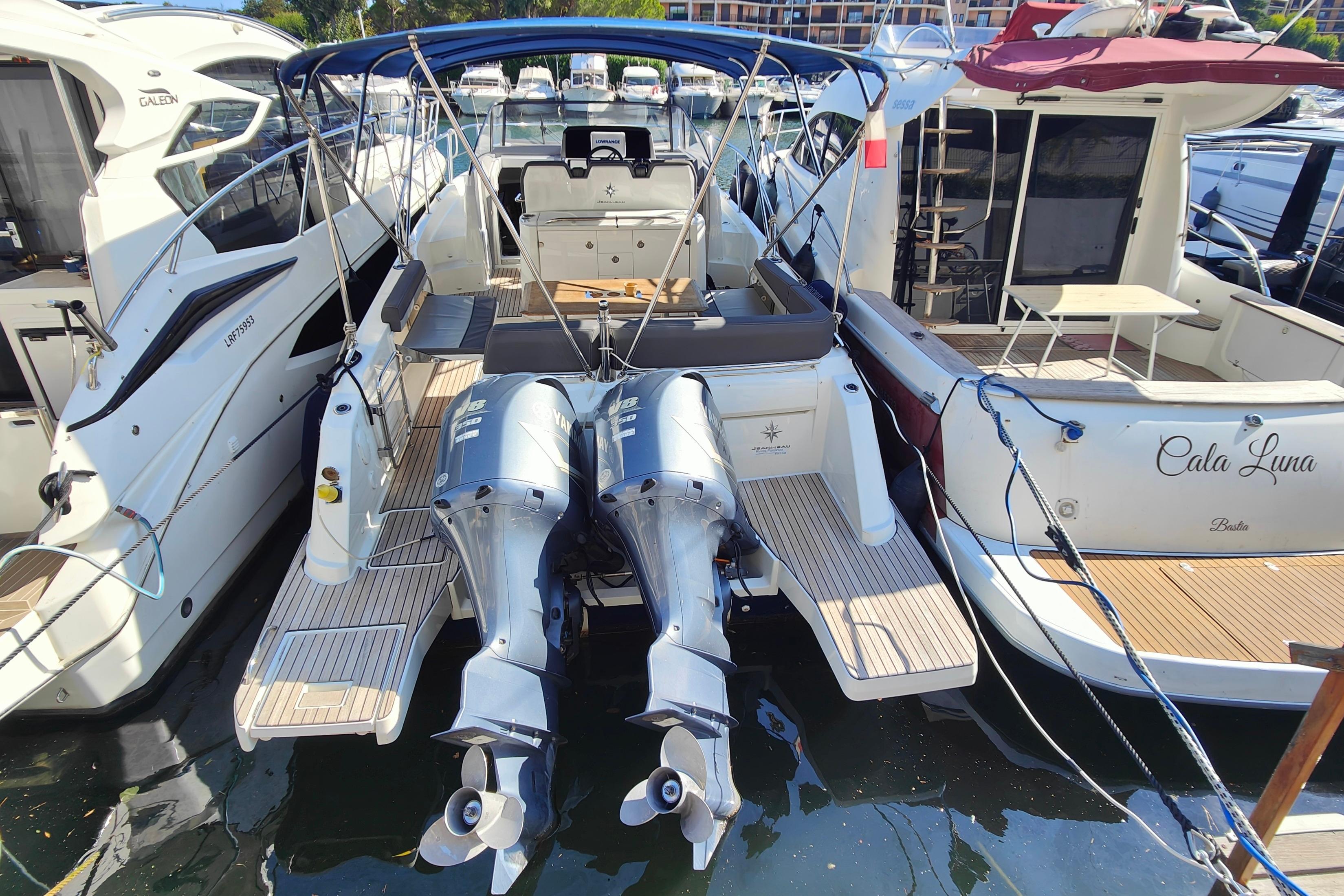 Jeanneau Cap Camarat 10.5 WA 2018 Jeanneau Cap Camarat 10.5 WA docked with twin outboard engines.