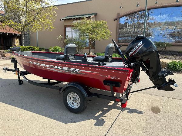 Tracker Super Guide V-16 T 2025 Tracker Super Guide V-16 T boat with Mercury engine, parked outdoors.