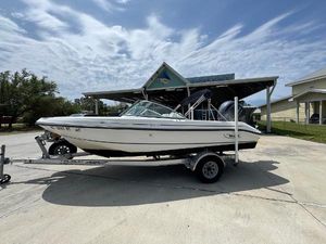 Boston Whaler 18 Ventura 2001 Boston Whaler 18 Ventura boat on trailer, parked outdoors under cloudy sky.