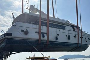 Sanlorenzo 82 Sanlorenzo 82 yacht from 1998 being lifted by crane, clear sky background.