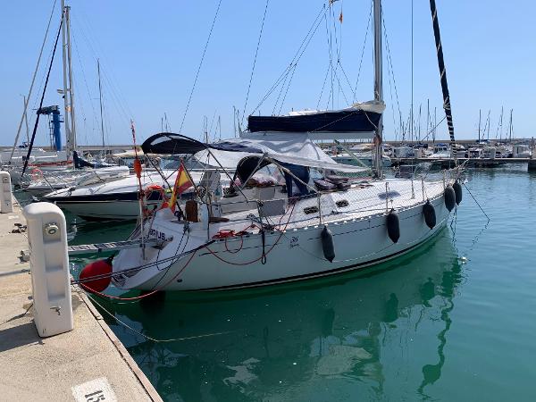 Dufour 36 Classic Sailboat Dufour 36 Classic 2000 docked in marina, sunny day, calm waters.