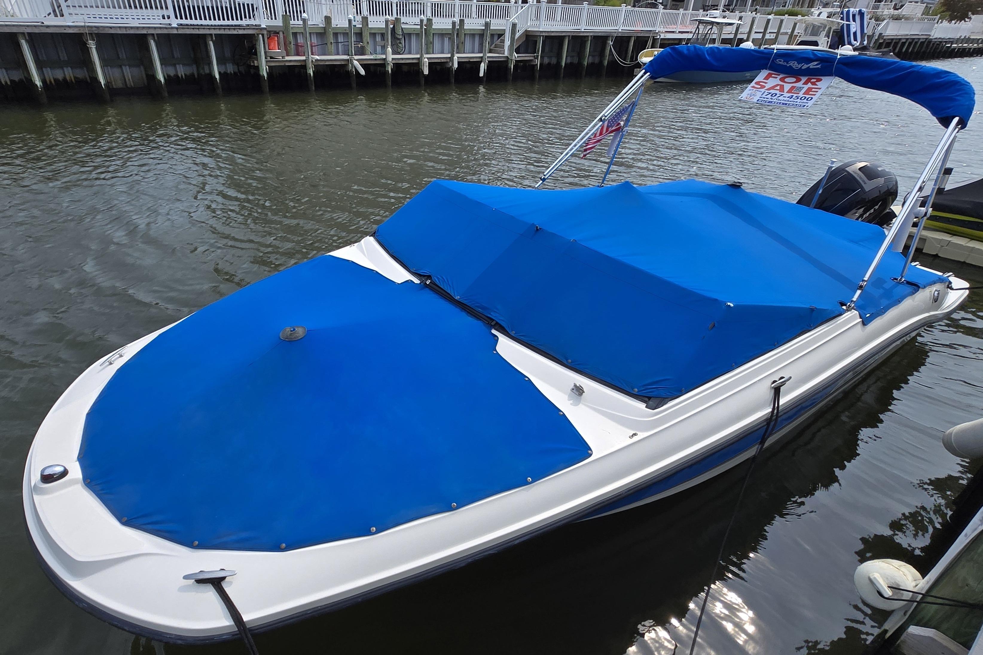 Sea Ray SPX 210 Outboard 2016 Sea Ray SPX 210 Outboard boat with blue cover, docked and for sale.