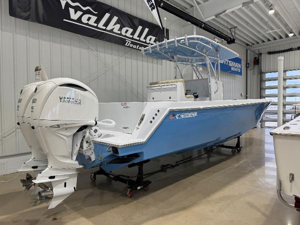 Contender 32 ST 2025 Contender 32 ST boat with twin Yamaha engines in a showroom.