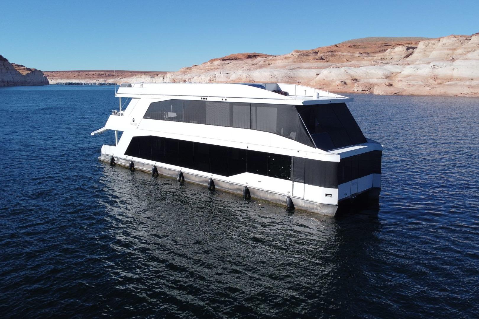 Adonia Oasis Share # 3 Modern Adonia Oasis Share #3 houseboat on serene lake, 2025 model.