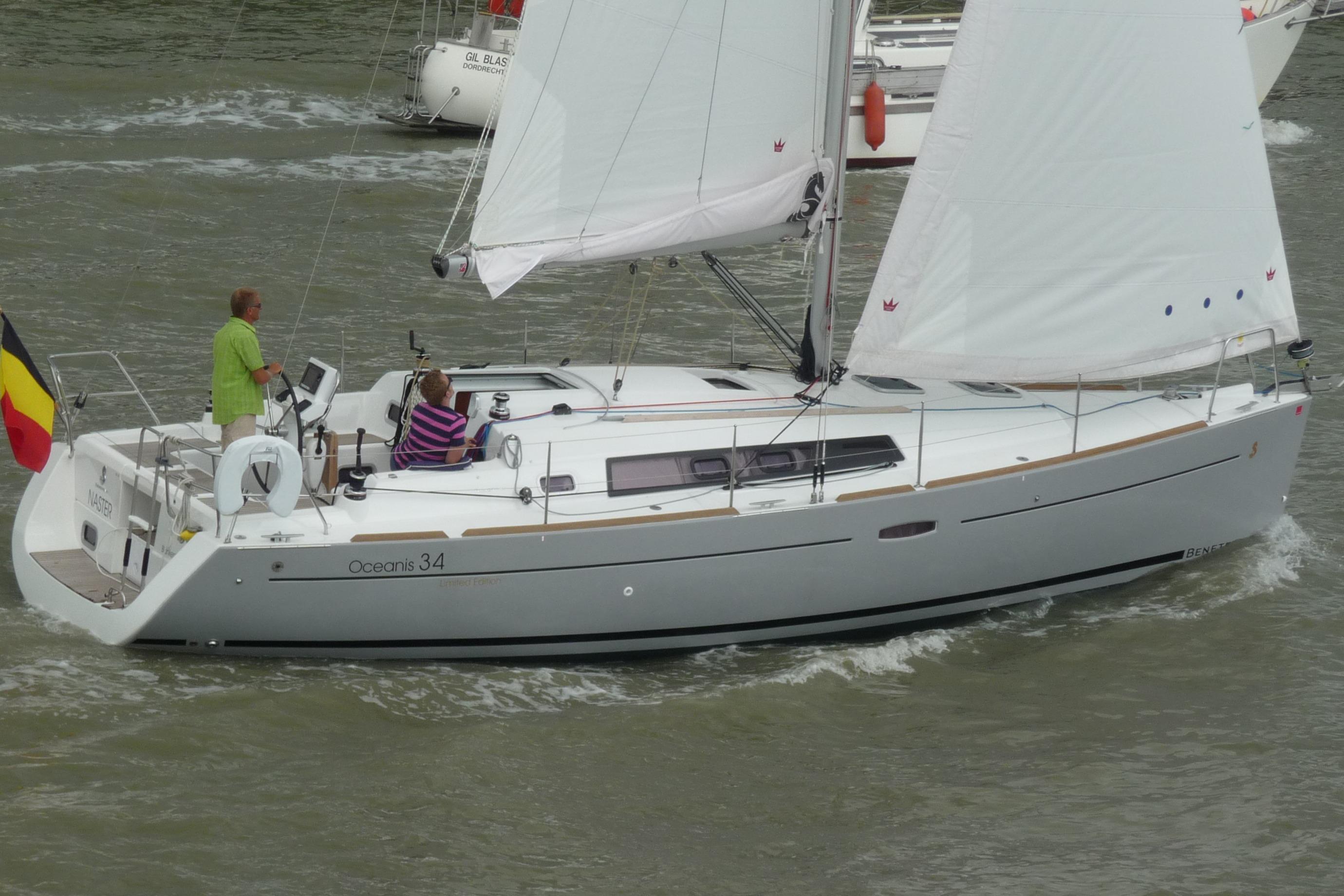 Beneteau Oceanis 34 2013 Beneteau Oceanis 34 sailboat on water, featuring white sails and a Belgian flag.