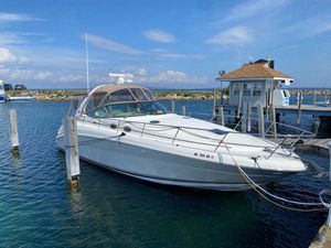 Sea Ray 360 Sundancer 2003 Sea Ray 360 Sundancer docked at a marina under a clear blue sky.