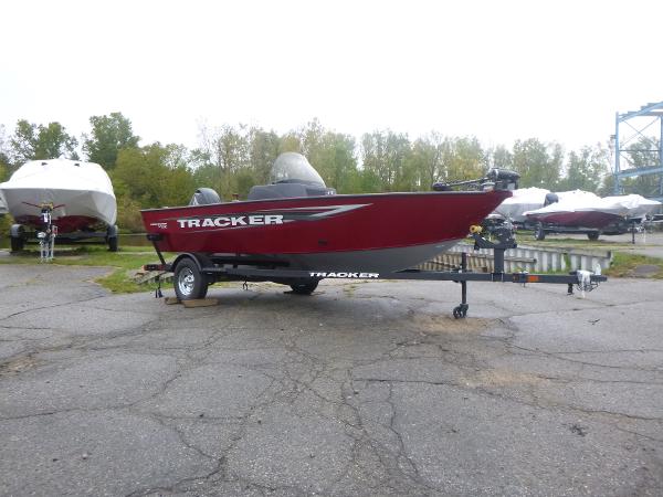 Tracker Pro Guide V-16 SC 2025 Tracker Pro Guide V-16 SC boat on trailer, parked outdoors.