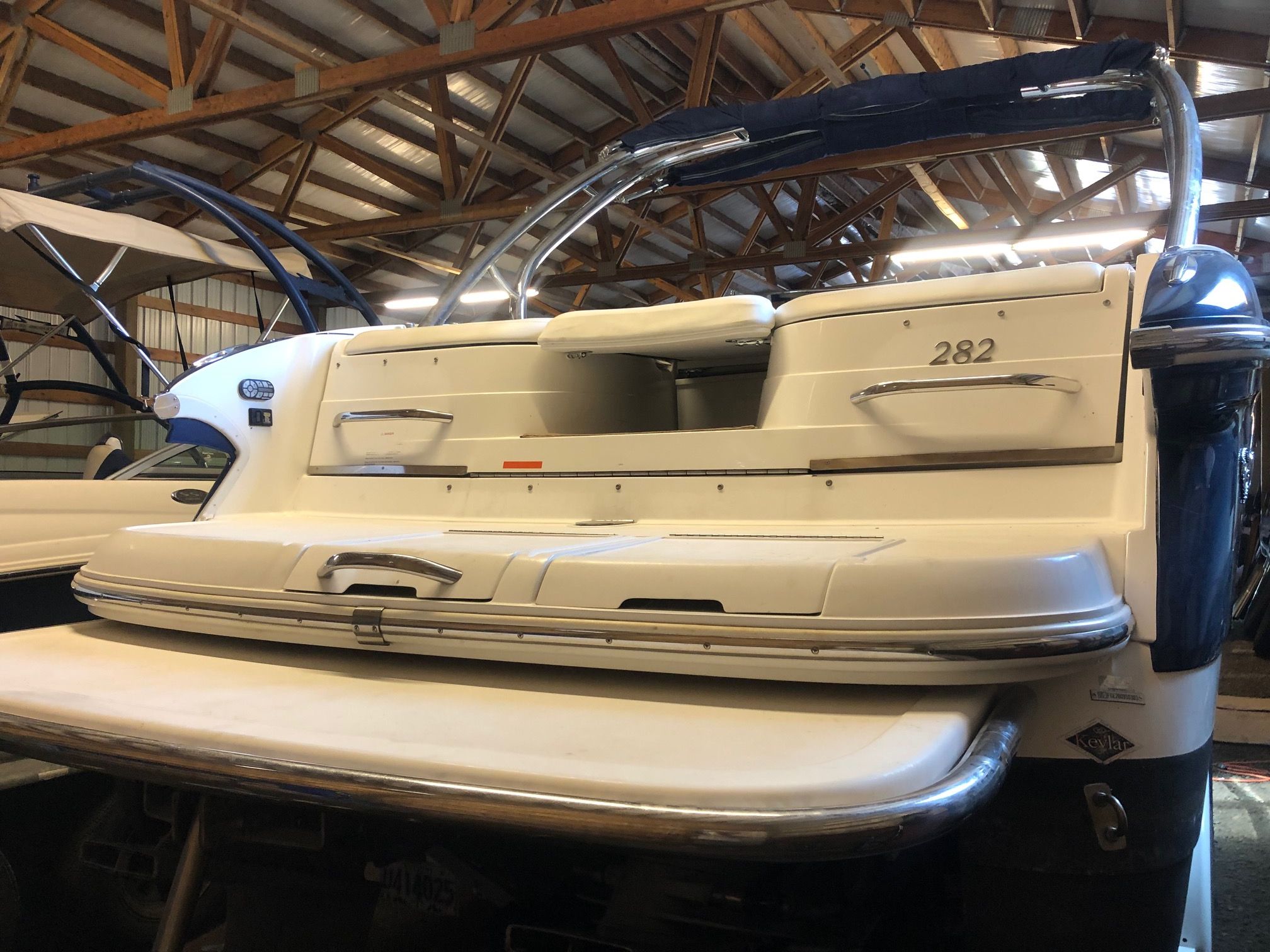Cobalt 282 2003 Cobalt 282 boat in storage, showcasing rear deck and sleek design.