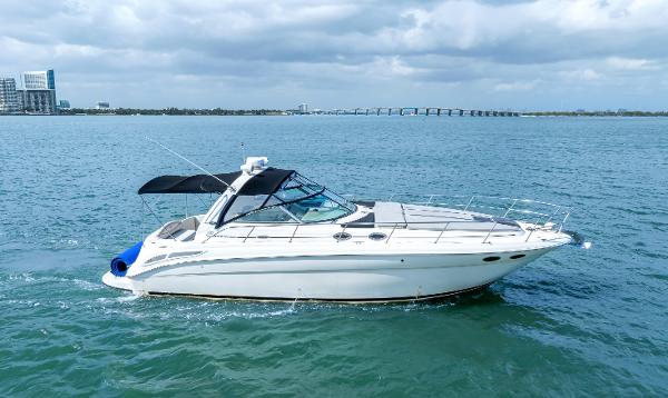 Sea Ray 380 Sundancer 2003 Sea Ray 380 Sundancer yacht cruising on open water under cloudy skies.
