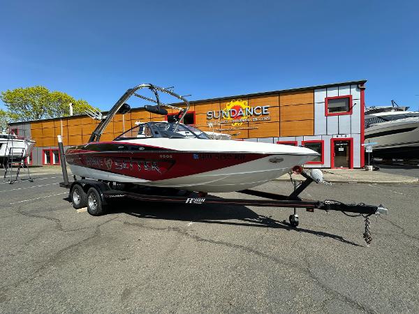 Malibu Wakesetter 21 VLX 2010 Malibu Wakesetter 21 VLX boat on trailer outside Sundance building.