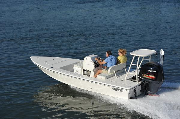 Hewes 18 Redfisher 2024 Hewes 18 Redfisher boat cruising on water with two passengers.