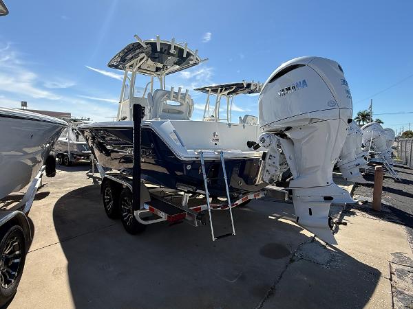 Pathfinder 2400 Open 2025 Pathfinder 2400 Open boat with Yamaha outboard motor, parked on a trailer.