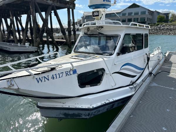 ACB 23/26 Explorer 2002 ACB 23/26 Explorer boat docked at marina with registration number WN 4117 RL.