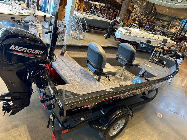 Tracker Super Guide V-16 T 2025 Tracker Super Guide V-16 T boat with Mercury engine displayed indoors.