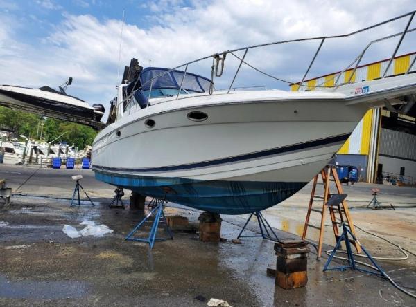 Formula 31 PC 2000 Formula 31 PC boat on stands in a marina for maintenance.