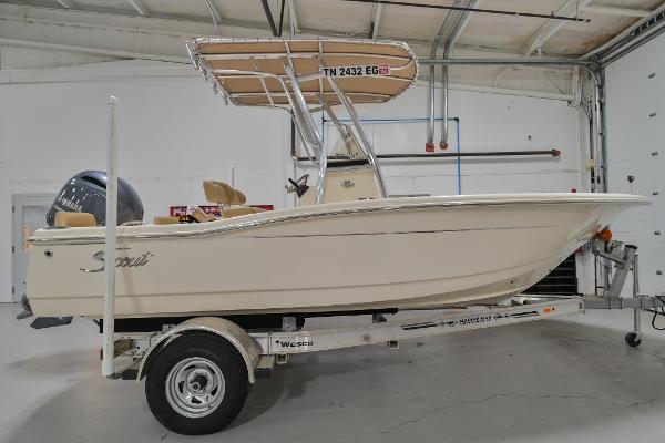 Scout 195 Sportfish 2020 Scout 195 Sportfish boat on trailer in indoor storage.