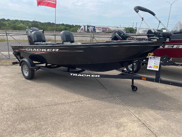 Tracker Super Guide V-16 T 2025 Tracker Super Guide V-16 T boat on trailer, displayed outdoors.