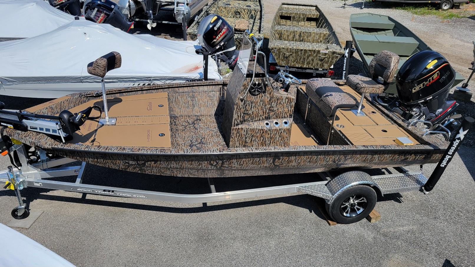 Xpress Xpress H190 Bay (In stock!) 2025 Xpress H190 Bay boat in stock, camo design, on trailer, with motor.