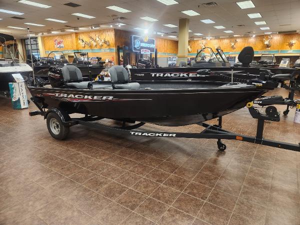 Tracker Super Guide V-16 T 2025 Tracker Super Guide V-16 T boat displayed in a showroom.