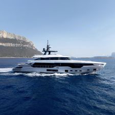 Azimut Grande Trideck 2023 Azimut Grande Trideck yacht cruising on open sea with scenic coastal backdrop.