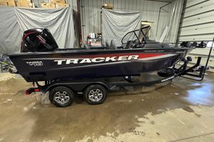 Tracker Targa V-19 WT 2025 Tracker Targa V-19 WT boat in garage, side view, on trailer.