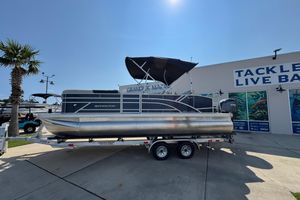 Bennington 22 SSB 2026 Bennington 22 SSB pontoon boat on trailer at marina.